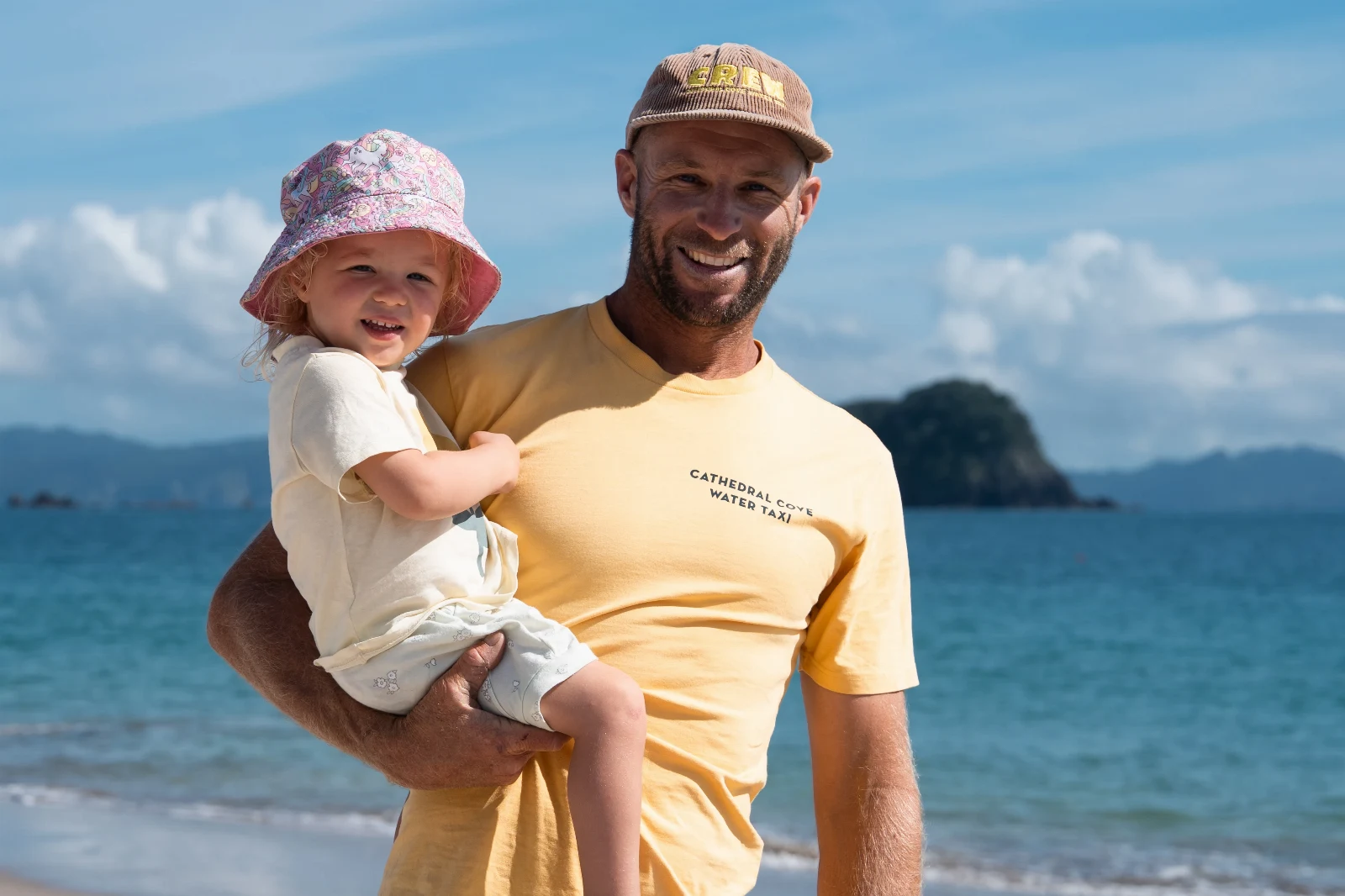 Hayden with his child on the beach