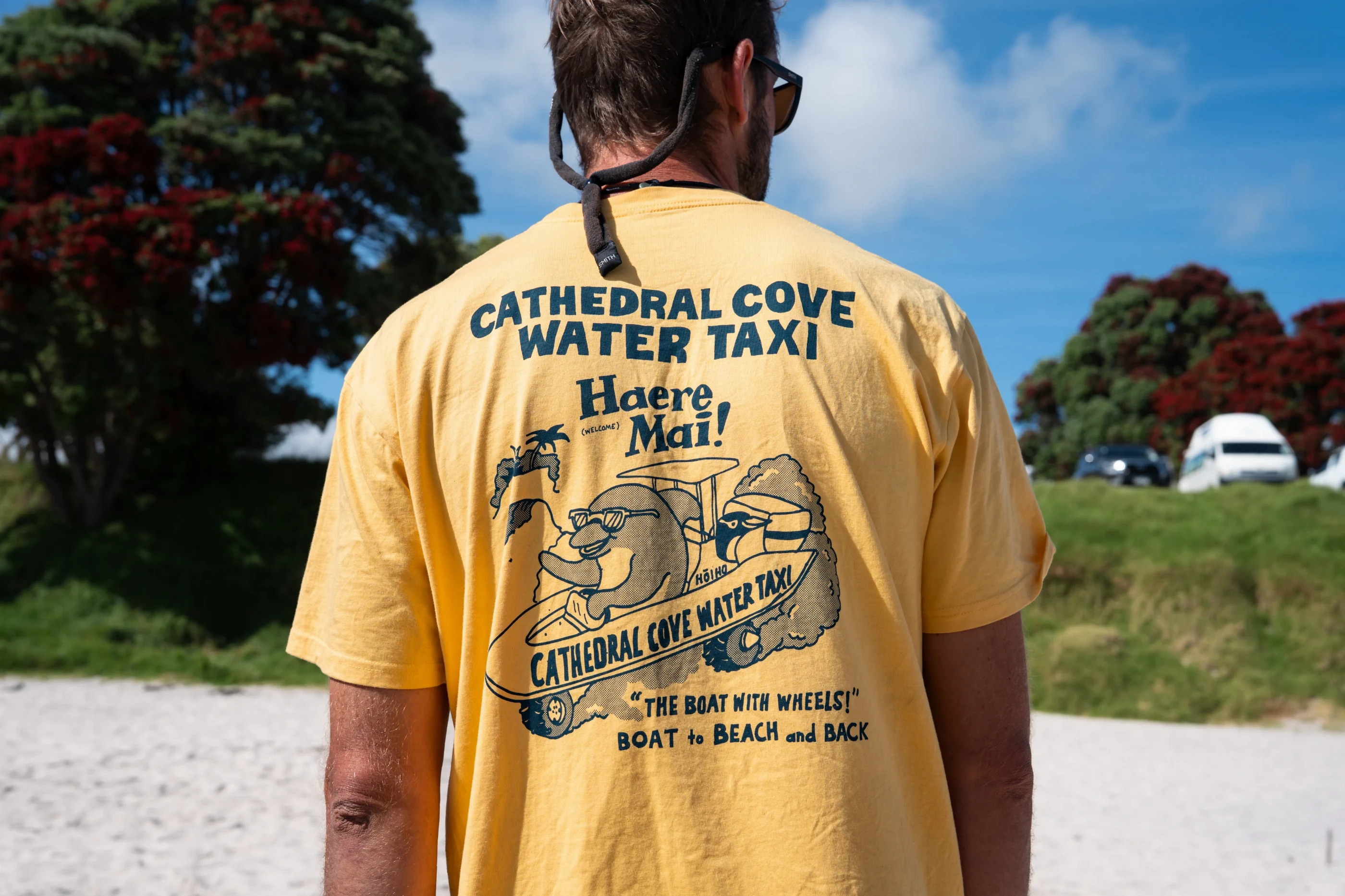 Our crew's yellow Cathedral Cove Water Taxi shirt